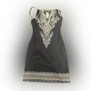 Black dress with design. Size small brand unknown. Never worn